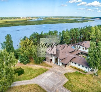 Luxury villa with a swimming pool and river views in Priedaine